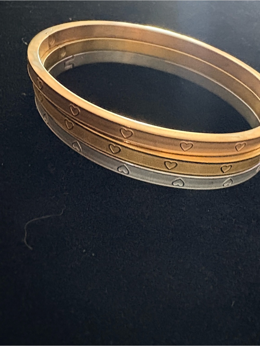 Oval fitted to wrist Tri-Tone Heart Accent Stackable Bangle Bracelet